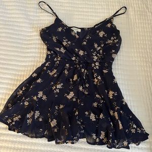 Francesca’s flower romper blue with white flowers